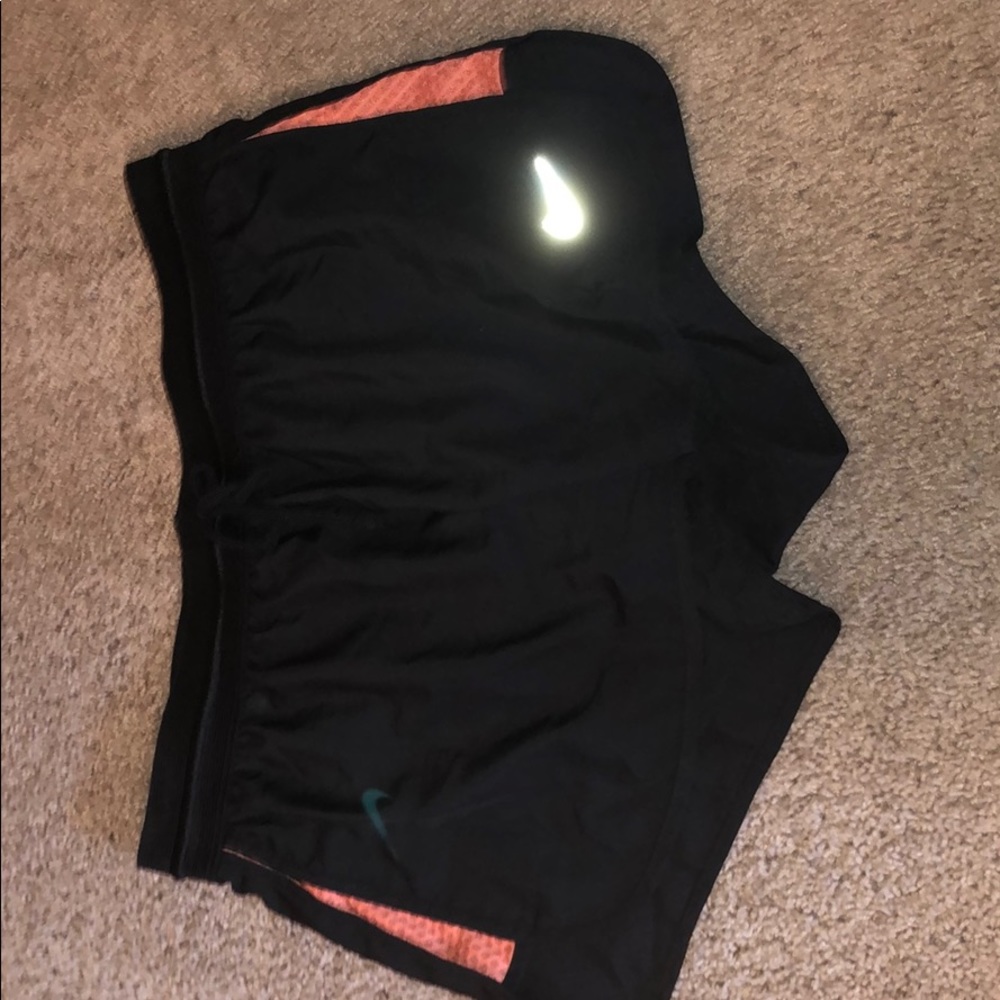 Nike shorts with Coral Coloring on sides